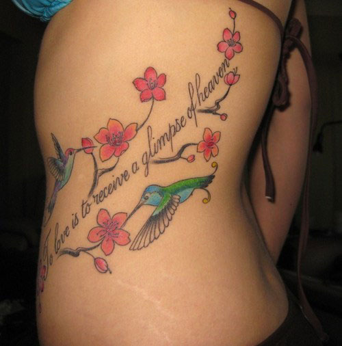 Flying Birds With Flowers Tattoo On Side Rib