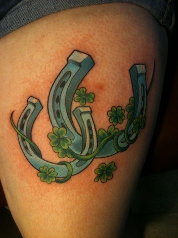 Green Clover Leaves And Horse Shoe Tattoo On Thigh
