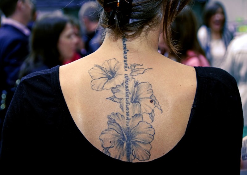Grey Ink Hibiscus Flowers Tattoo On Girl Upper Back By Editzel