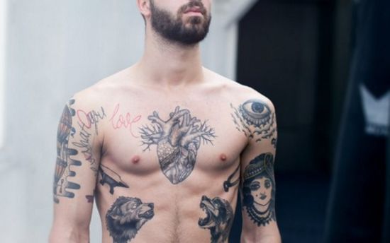 Grey Ink Real Heart Tattoo On Man Chest
