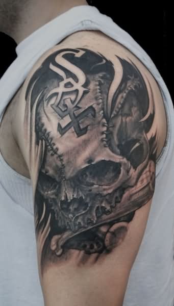 Grey Ink Skull Tattoo On Left Half Sleeve
