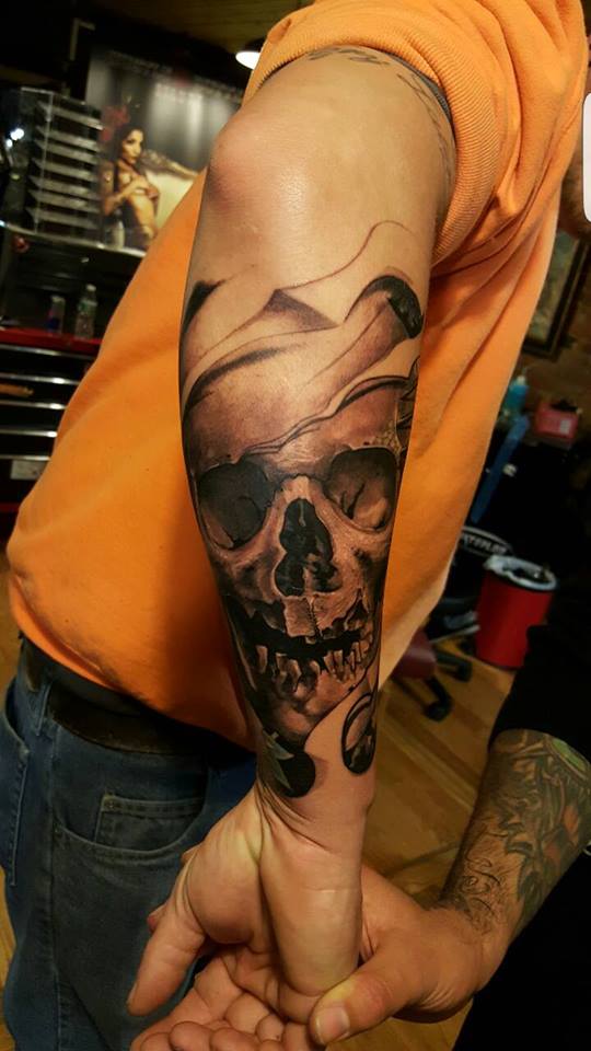 Grey Ink Skull Tattoo On Right Forearm by Schrail Edmund