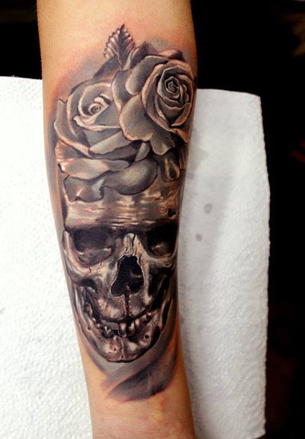 Grey Ink Skull With Roses Tattoo Design For Forearm