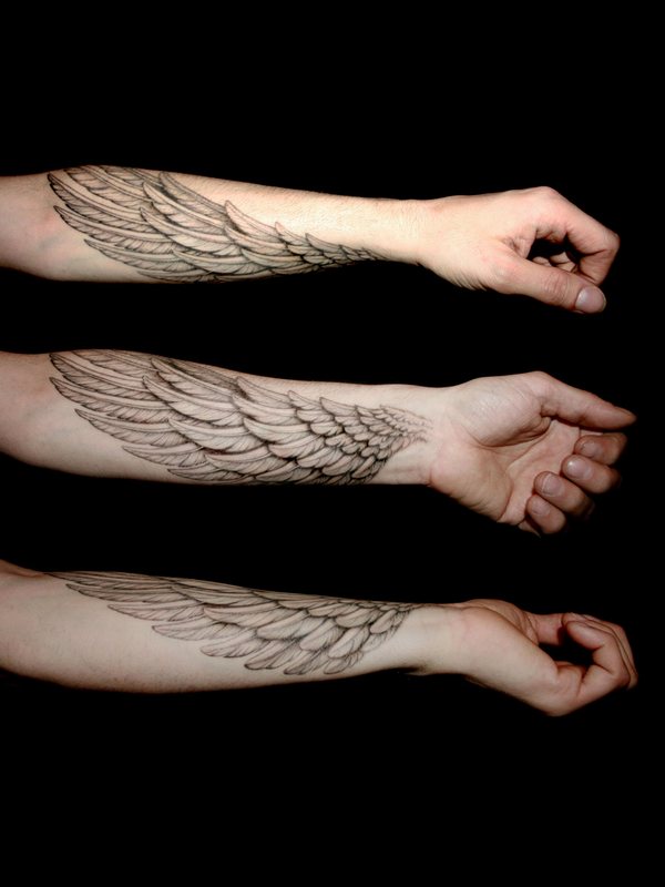 Grey Ink Wing Tattoo On Forearm