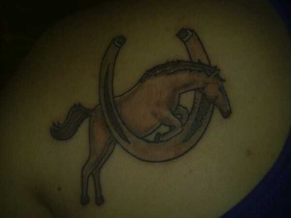 Jumping Horse And Horse Shoe Tattoo On Back Shoulder