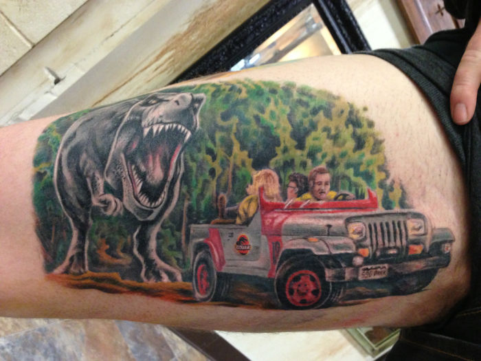 Jurassic Park Dinosaur Tattoo On Bicep