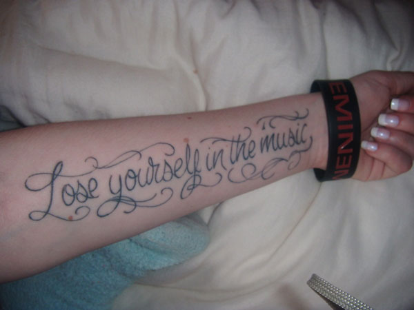 Lose Yourself In The Music Words Tattoo On Left Forearm