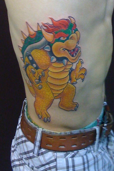 Man Rib Side Dinosaur Tattoo