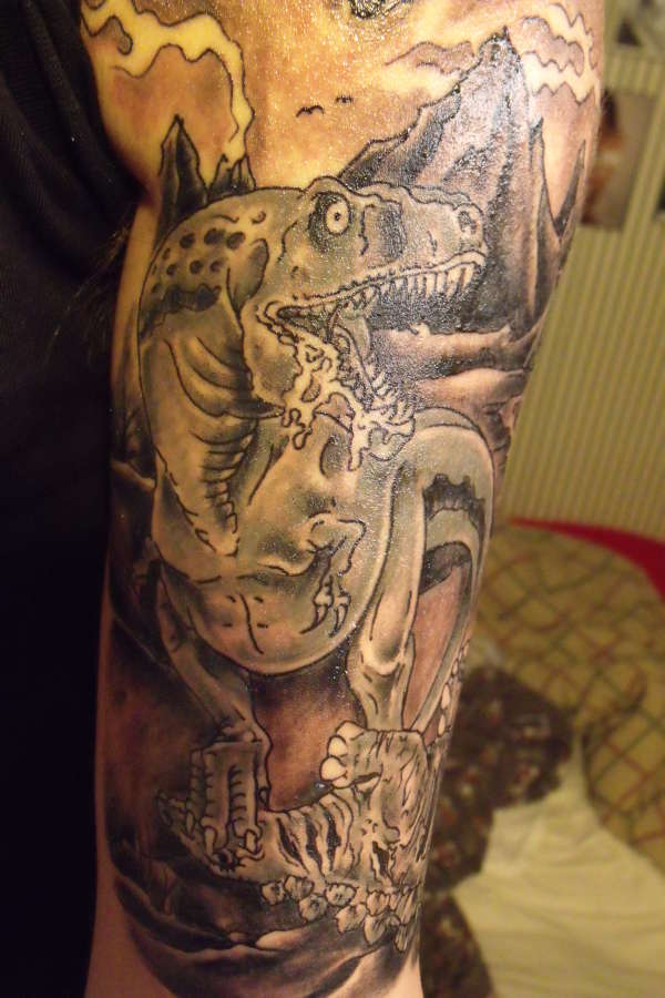 Nice Grey Dinosaur Tattoo On Half Sleeve