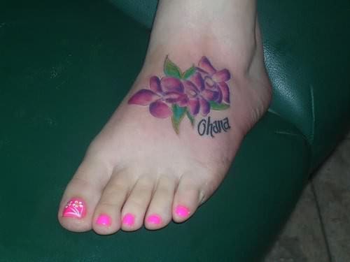 Ohana - Purple Hibiscus Flowers Tattoo On Girl Left Foot