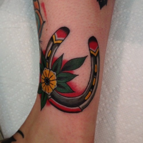 Old School Flower And Horseshoe Tattoo On Leg