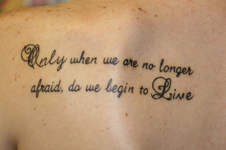 Only When We Are No Longer Afraid, Do We Begin To Live - Quote Tattoo On Back Shoulder