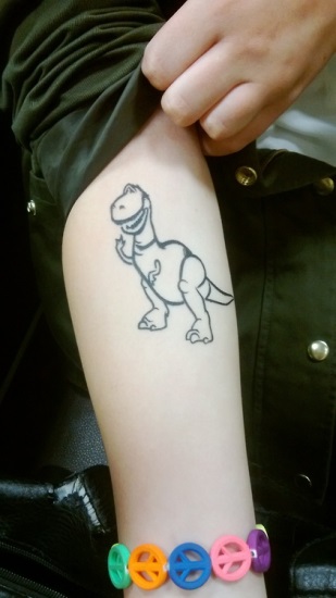 Outline Dinosaur Tattoo On Arm