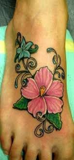 Pink And Blue Hibiscus Flowers Tattoo On Foot