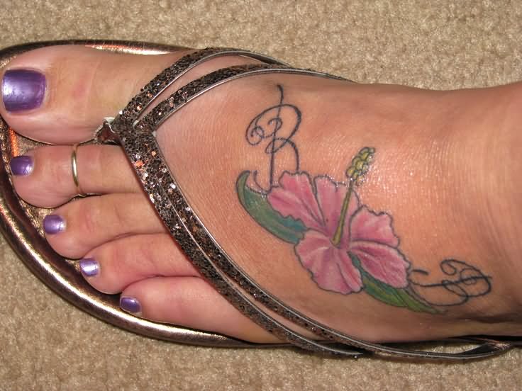 Pink Ink Hibiscus Flower Tattoo On Girl Left Foot