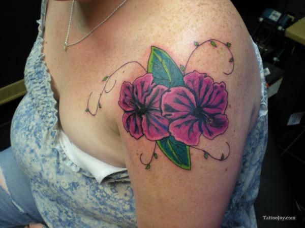 Purple Ink Hibiscus Flowers Tattoo On Women Left Shoulder
