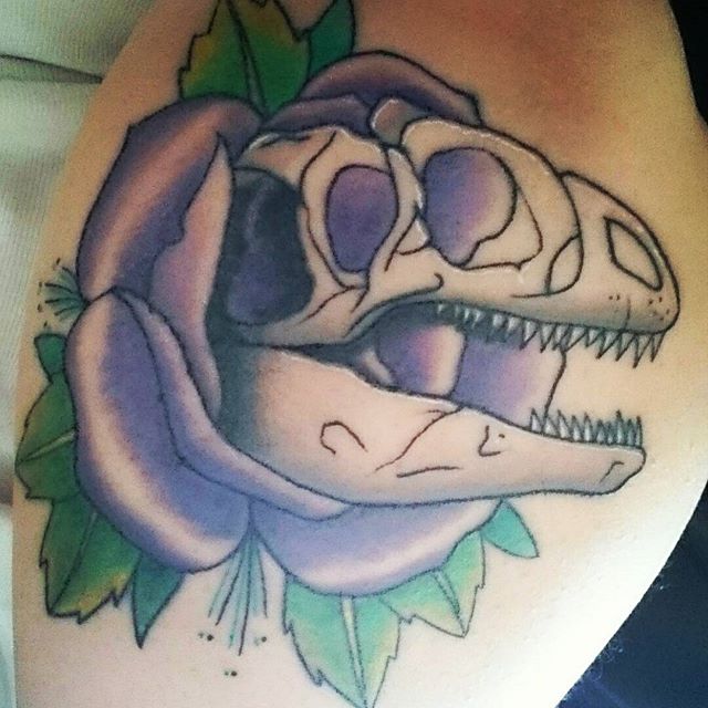 Purple Rose Flower And Dinosaur Skull Tattoo