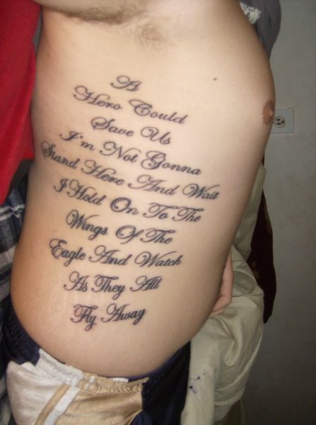 Quote Tattoo On Man Right Side Rib