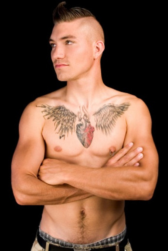 Real Heart Wings Tattoo On Man Chest