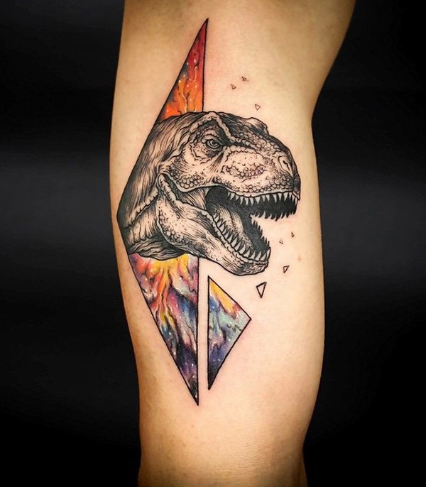 Ripped Skin Dinosaur Tattoo On Bicep