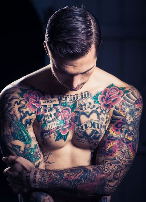 Roses With Banner And Skull Tattoo On Man Chest