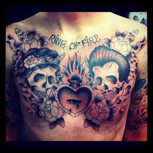 Sacred Heart With Skulls And Roses Tattoo On Man Chest