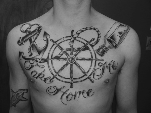Sailor Wheel With Scroll In Bottle And Anchor Tattoo On Man Chest
