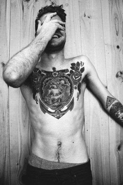 Ship In Frame With Roses Tattoo On Man Chest