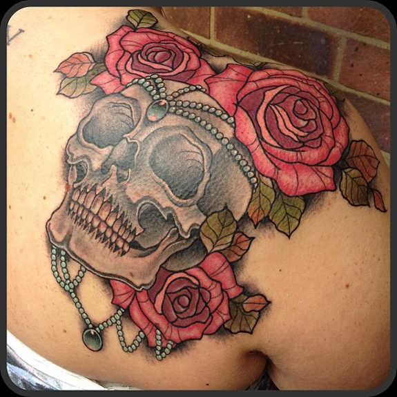 Shoulder Cap Skull And Flowers Tattoo
