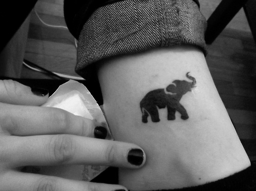 Silhouette Elephant Trunk Up Tattoo Design For Leg