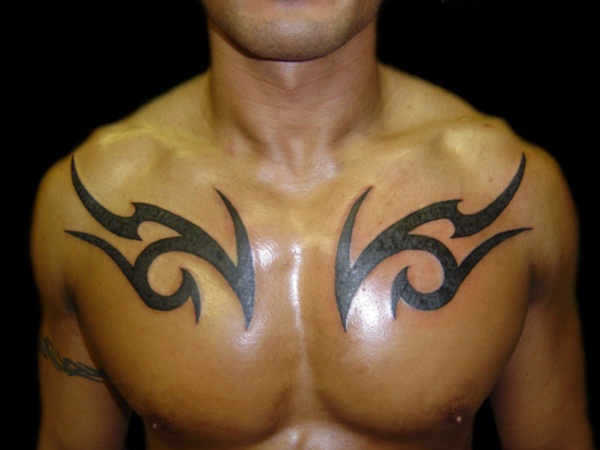 Simple Black Tribal Design Tattoo On Man Chest