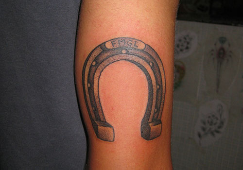 Simple Grey Horseshoe Tattoo On Arm
