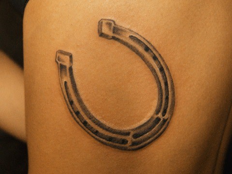Simple Horse Shoe Tattoo On Side Rib