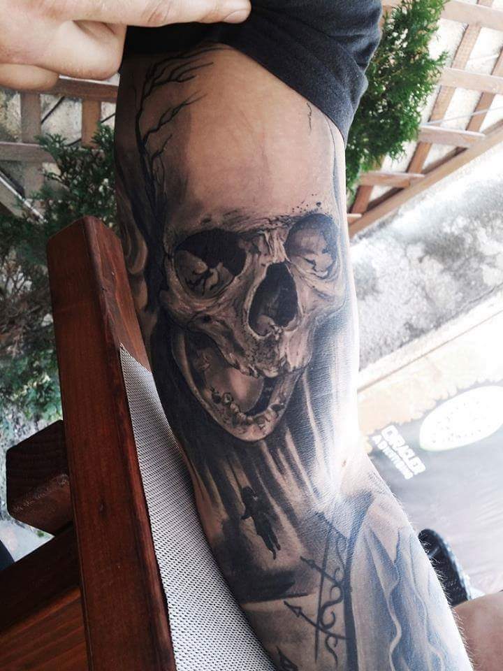 Skull Tattoo On Muscles by Schrail Edmund