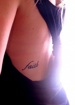 Small Faith Lettering Tattoo On Girl Side Rib