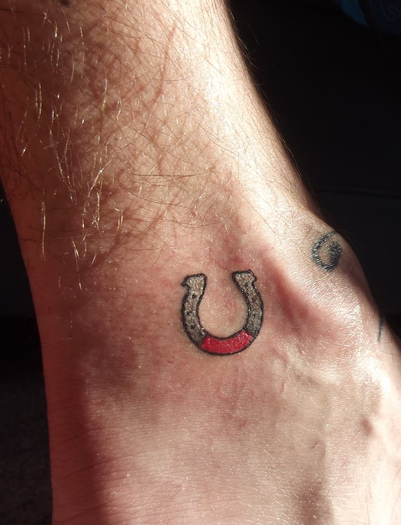 Small Horse Shoe Tattoo On Ankle