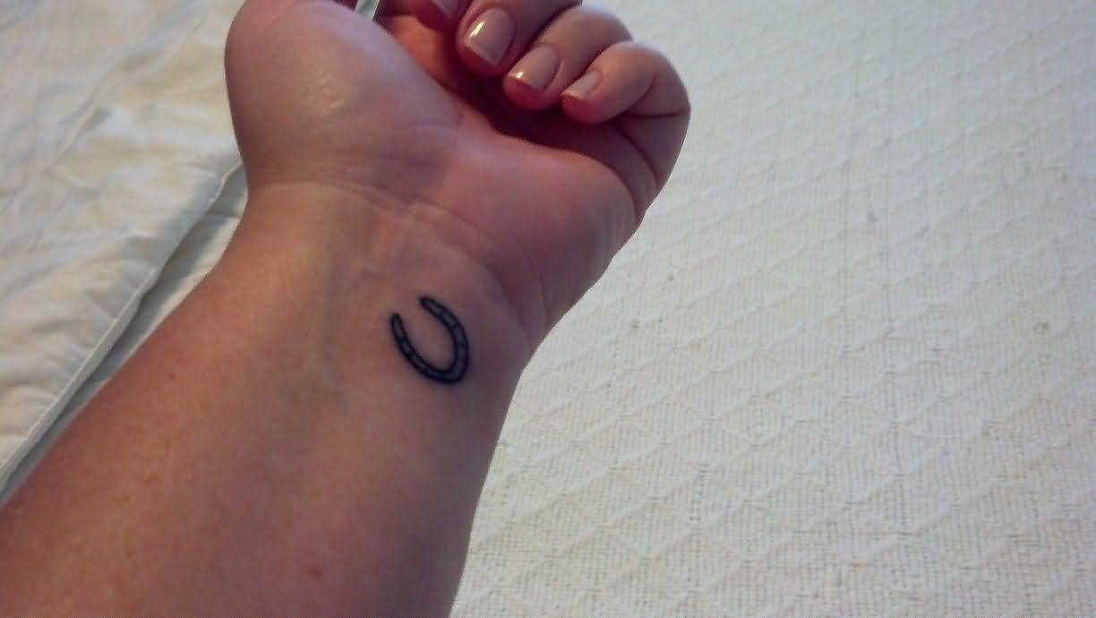 Small Horseshoe Tattoo On Left Wrist