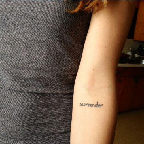 Surrender Word Tattoo On Forearm