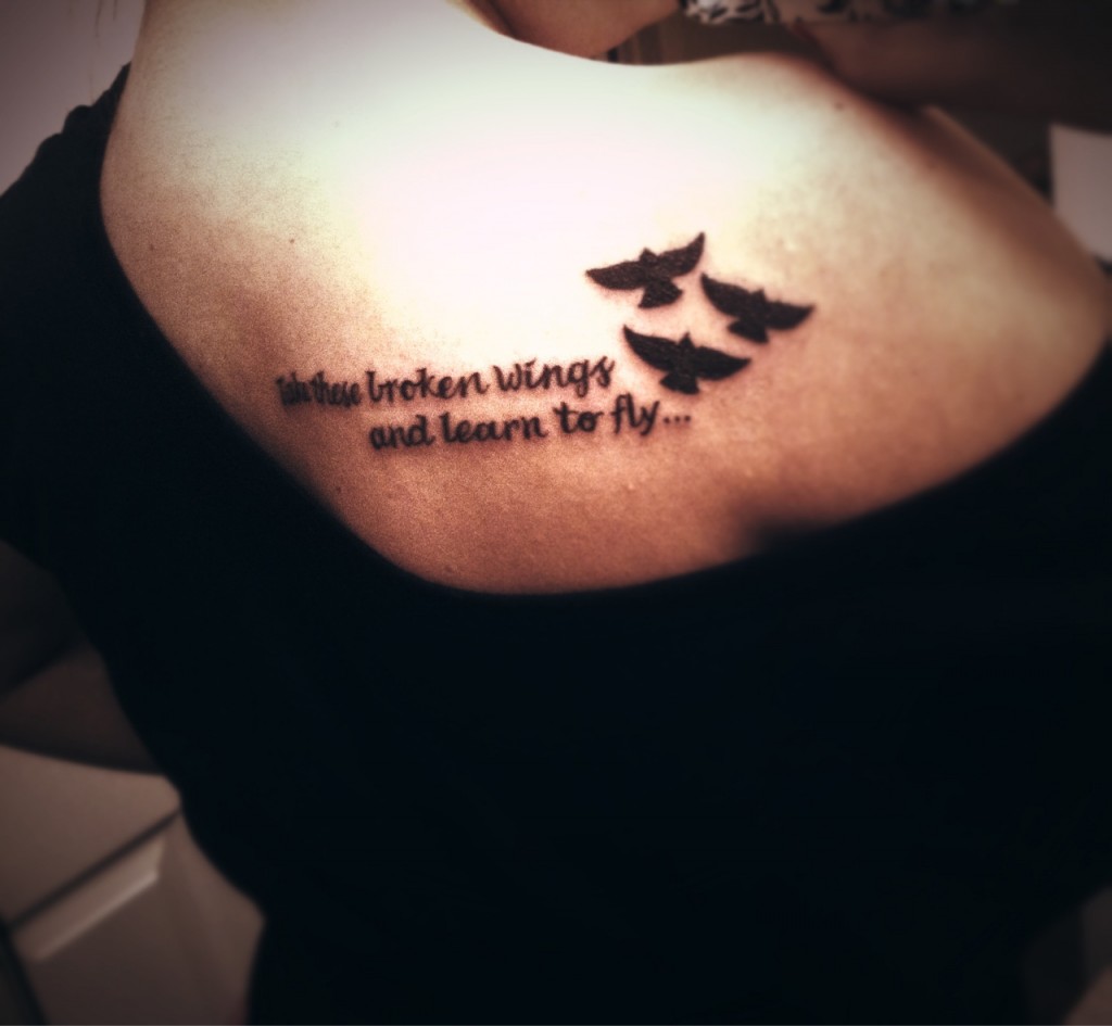 Take These Broken Wings And Learn To Fly Quote Tattoo On Back Shoulder