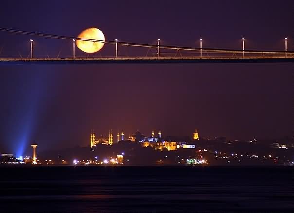 The Bosphorus Bridge With Full Moon At Night