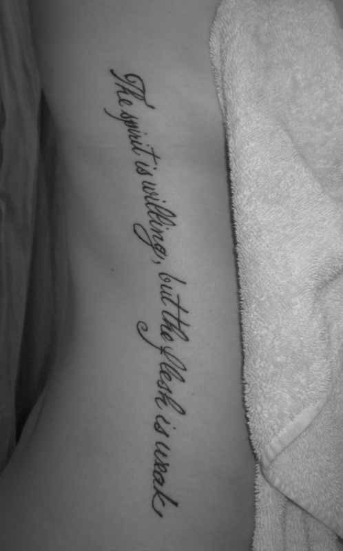The Spirit Is Willing But The Flesh Is Weak Quote Tattoo On Right Side Rib