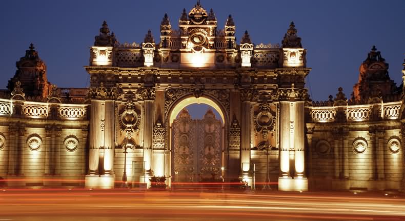 The Treasury Gate Of The Dolmabahce Palace Lit Up At Night
