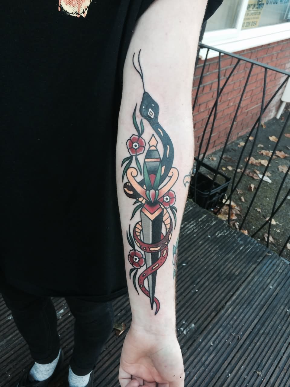 Traditional Dagger With Snake Tattoo On Left Forearm