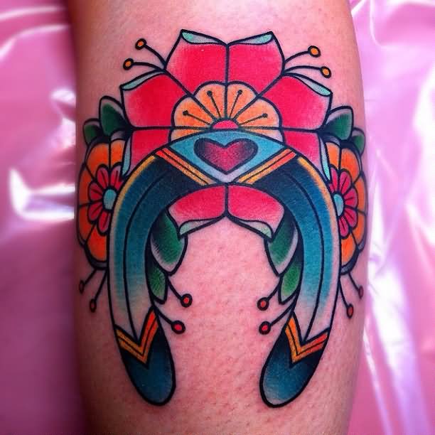 Traditional Flowers And Horseshoe Tattoo