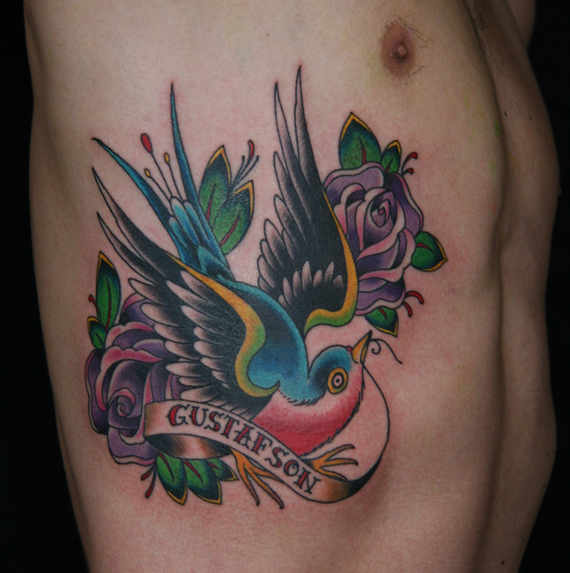 Traditional Flying Bird With Rose And Banner Tattoo On Man Side Rib