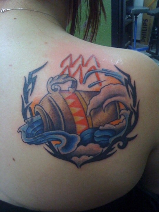 Tribal Aquarius Tattoo On Right Back Shoulder