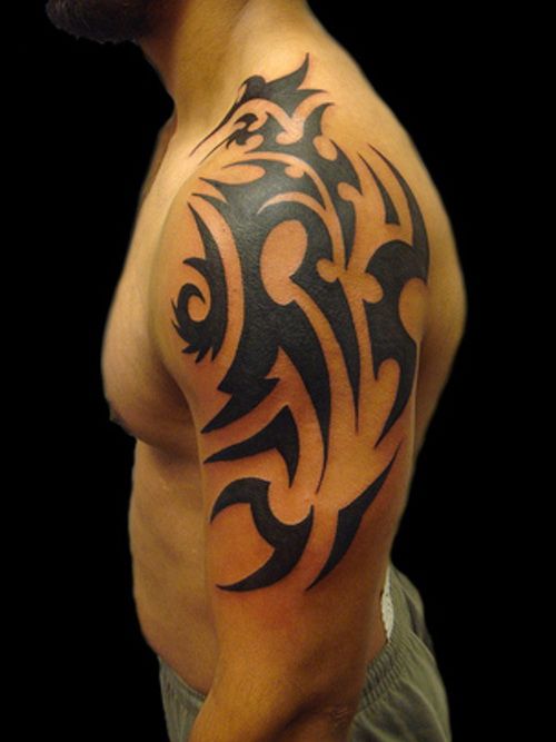 Tribal Tattoo On Man Left Half Sleeve
