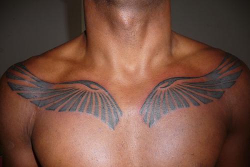 Tribal Wings Tattoo On Man Chest