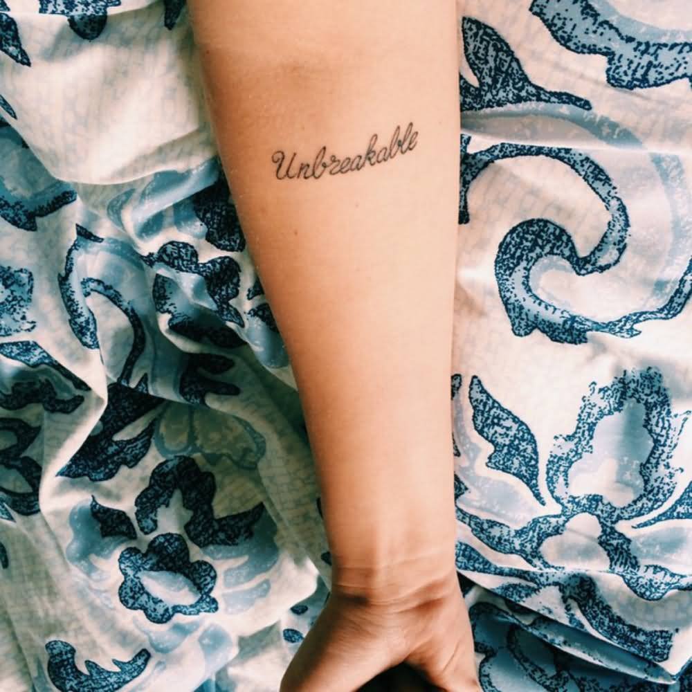 Unbreakable Word Tattoo On Forearm