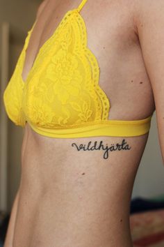 Vildhjarta Lettering Tattoo On Girl Left Side Rib